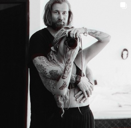Simon holding a camera